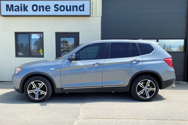 2011 BMW X3 with professional window tint in North Bay